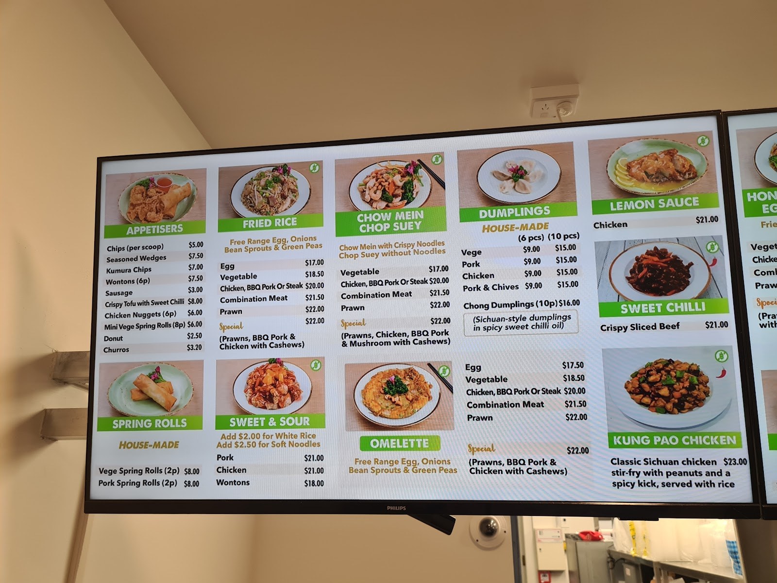 Menu board: fried rice, chop suey, dumplings, spring rolls and sauces with prices