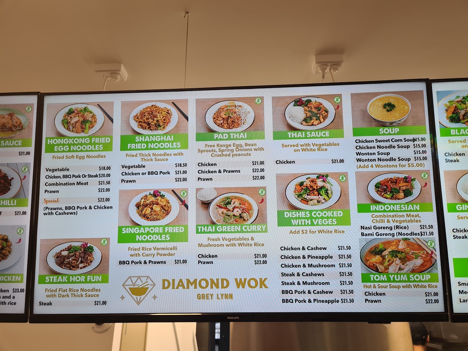 Menu board: udon, pad thai, curries, soups and Thai sauces with prices