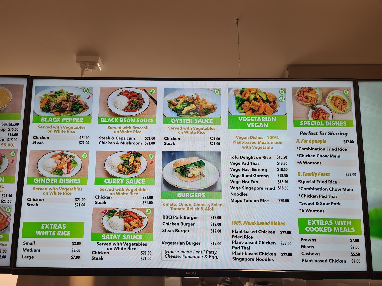 Menu board: black bean, oyster and curry sauces, burgers and vegetarian dishes